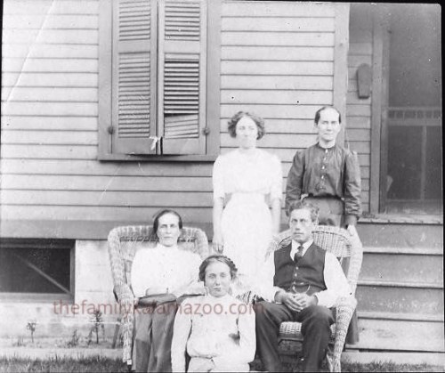 Cora and Adrian in chairs. Standing are Cora's stepsister Marian Sootsman and sister Jennie DeKorn Leeuwenhoek. Seated in front is Jennie's daughter Alice.