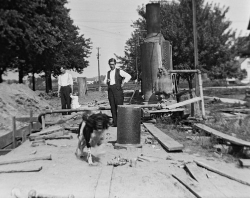 Is the dog running toward Richard DeKorn?